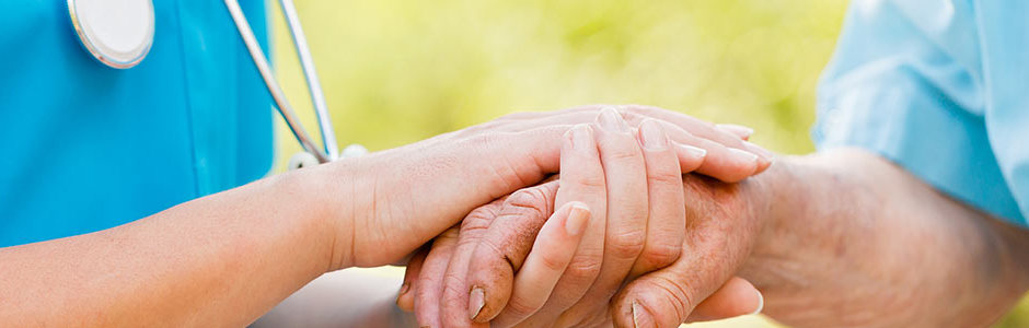 doctor holding patients hand